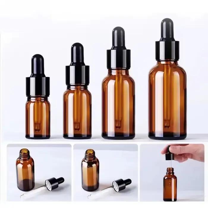Flacon compte-gouttes vide en verre d'huile essentielle ambre, liquide d'aromathérapie marron, goutt
